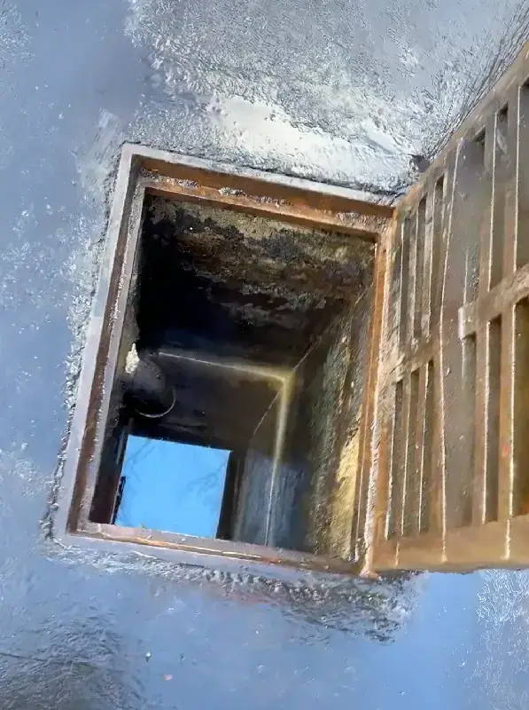 Catch basin after jet-vac cleaning with sediment removed and the sump clear