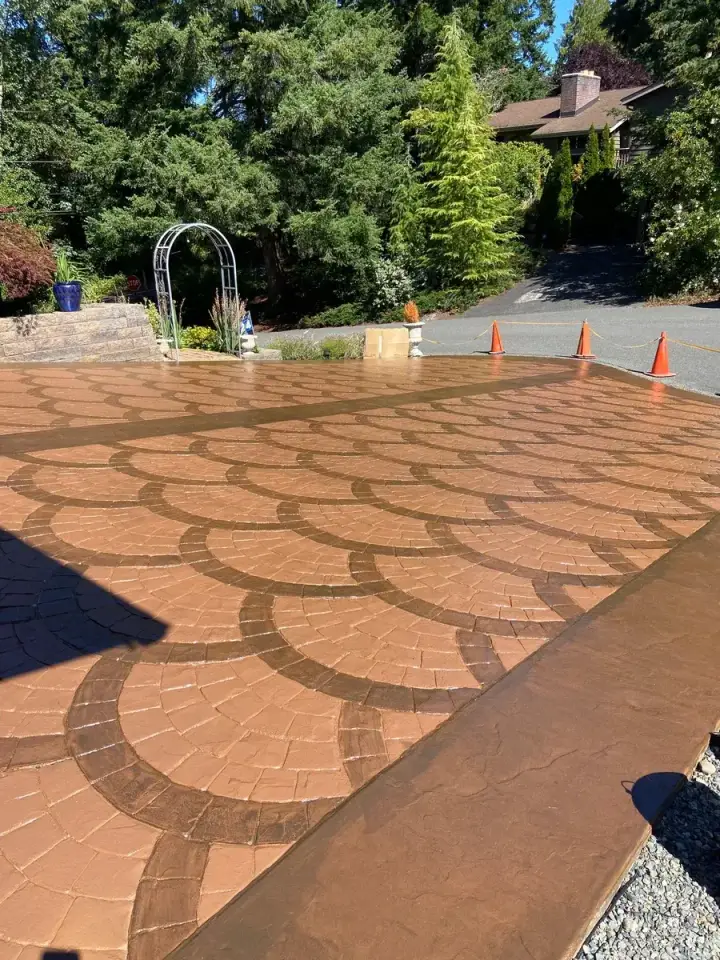 Fan-pattern concrete paver driveway in Western Washington, a surface that benefits from careful de-icer use in winter